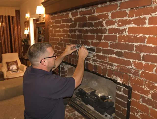 Hilliard Chimney Sweep expert fixing a fireplace in Hilliard, OH
